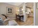 Inviting sitting room; view into the kitchen featuring granite counters and modern appliances at 2584 Oglethorpe Ne Cir, Brookhaven, GA 30319