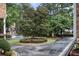 Peaceful street with lush green trees and well-maintained landscaping, showcasing a serene neighborhood at 2584 Oglethorpe Ne Cir, Brookhaven, GA 30319