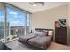Cozy bedroom with a large window and cityscape view offering natural light at 3325 Piedmont Ne Rd # 2501, Atlanta, GA 30305