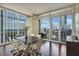 Modern dining room with floor-to-ceiling windows and access to balcony and city views at 3325 Piedmont Ne Rd # 2501, Atlanta, GA 30305