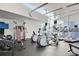 Well-equipped gym with modern exercise machines and large windows providing ample natural light at 3325 Piedmont Ne Rd # 2501, Atlanta, GA 30305