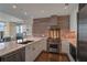 Modern kitchen featuring stainless steel appliances, white cabinets, and stone countertops at 3325 Piedmont Ne Rd # 2501, Atlanta, GA 30305