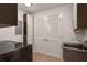 Convenient laundry room with modern washer, sink, and storage cabinets at 3325 Piedmont Ne Rd # 2501, Atlanta, GA 30305