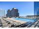 Relaxing rooftop pool area with ample lounge seating and a clear view of the city buildings at 3325 Piedmont Ne Rd # 2501, Atlanta, GA 30305