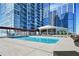 Beautiful rooftop pool with seating, lounge chairs, and a shaded structure, all with great city views at 3325 Piedmont Ne Rd # 2501, Atlanta, GA 30305