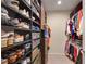 Organized walk-in closet with shelves and hanging rods, offering ample storage space for clothes and shoes at 3325 Piedmont Ne Rd # 2501, Atlanta, GA 30305
