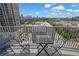 Balcony view of the cityscape, providing a scenic outdoor space with seating and tables at 361 17Th St # 1121, Atlanta, GA 30363