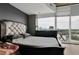 Bedroom with large window views, a comfortable bed, and plenty of natural light at 361 17Th St # 1121, Atlanta, GA 30363