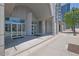 Modern building entrance featuring glass doors, concrete columns, and clear signage for easy access at 361 17Th St # 1121, Atlanta, GA 30363