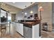 Modern kitchen with black countertops, white cabinets, and stainless steel appliances, and an open layout at 361 17Th St # 1121, Atlanta, GA 30363