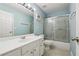 Bathroom with walk-in shower and modern vanity at 8965 Friarbridge Dr, Suwanee, GA 30024