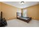 Bedroom featuring a bed frame, neutral carpet, and natural light at 8965 Friarbridge Dr, Suwanee, GA 30024