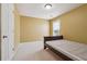 Cozy bedroom with neutral walls, carpet flooring, and a twin bed at 8965 Friarbridge Dr, Suwanee, GA 30024