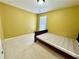 Cozy bedroom with neutral carpet, a single bed, and a window allowing natural light at 8965 Friarbridge Dr, Suwanee, GA 30024