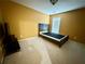 Bedroom featuring neutral carpet, a bed, and a window for natural light at 8965 Friarbridge Dr, Suwanee, GA 30024
