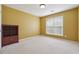 Bedroom with neutral carpet, natural light, and bookshelf at 8965 Friarbridge Dr, Suwanee, GA 30024