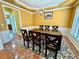 Warm dining area with wainscoting, a chandelier, and seating for six at 8965 Friarbridge Dr, Suwanee, GA 30024