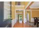 Inviting foyer featuring hardwood floors, high ceilings, and a view into the home at 8965 Friarbridge Dr, Suwanee, GA 30024