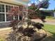 A Japanese maple adds elegance to the front yard and stonework of this home at 8965 Friarbridge Dr, Suwanee, GA 30024