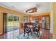 Bright eat-in kitchen with stainless steel appliances, wooden cabinets, and sliding doors to the backyard at 8965 Friarbridge Dr, Suwanee, GA 30024
