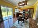 Sunlit kitchen features a breakfast nook, stainless steel appliances, and sliding door access to the backyard at 8965 Friarbridge Dr, Suwanee, GA 30024