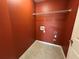 A dedicated laundry room with tile flooring, a storage rack, and washer-dryer hookups at 8965 Friarbridge Dr, Suwanee, GA 30024