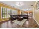 Spacious living room featuring a large window and view into the eat-in kitchen at 8965 Friarbridge Dr, Suwanee, GA 30024