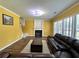 Inviting living room features a fireplace, plush seating, and wood-look flooring at 8965 Friarbridge Dr, Suwanee, GA 30024