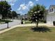 Picturesque street view with sidewalks and well-maintained lawns. Perfect for families at 8965 Friarbridge Dr, Suwanee, GA 30024