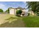 Expansive backyard with a well-maintained lawn and a view of the home's exterior and deck at 1024 Cromwell Pt, Snellville, GA 30078