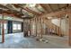 Unfinished basement featuring exposed framing, insulated walls, and a door to the exterior at 1024 Cromwell Pt, Snellville, GA 30078