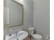 Half bathroom featuring a sink and a toilet at 1024 Cromwell Pt, Snellville, GA 30078
