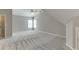 Bright bedroom with two windows, ceiling fan, neutral color palette and carpet flooring at 1024 Cromwell Pt, Snellville, GA 30078