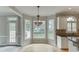 Bright breakfast area with large windows, adjacent to the kitchen, offering a view of the backyard at 1024 Cromwell Pt, Snellville, GA 30078
