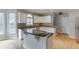 Bright kitchen features granite countertops, a large island, and stainless steel appliances at 1024 Cromwell Pt, Snellville, GA 30078