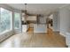 Spacious kitchen features an island, granite countertops, and stainless steel appliances at 1024 Cromwell Pt, Snellville, GA 30078