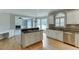 Open kitchen featuring granite countertops and stainless steel appliances, adjacent to the living area at 1024 Cromwell Pt, Snellville, GA 30078