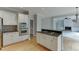 Kitchen with granite countertops and stainless appliances, open to the living area at 1024 Cromwell Pt, Snellville, GA 30078