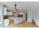 Open-concept kitchen featuring granite countertops, stainless steel appliances, and an adjacent breakfast area at 1024 Cromwell Pt, Snellville, GA 30078