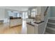 Open kitchen with granite countertops and stainless steel appliances connects to the living area at 1024 Cromwell Pt, Snellville, GA 30078