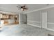 Open living room featuring carpet floors and easy access to the kitchen at 1024 Cromwell Pt, Snellville, GA 30078