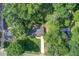 Aerial view of the property, highlighting the house, driveway, and surrounding trees at 2619 Old Toney Rd, Ellenwood, GA 30294