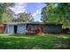 Exterior view of backyard with a deck and lush green lawn at 2619 Old Toney Rd, Ellenwood, GA 30294