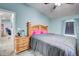 Comfortable bedroom boasts a ceiling fan, soft carpet, and light blue walls at 2619 Old Toney Rd, Ellenwood, GA 30294