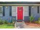 Close up of a red front door with stylish exterior lighting and landscaping at 2619 Old Toney Rd, Ellenwood, GA 30294