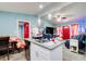 Kitchen island with a sink and pendant lighting that opens to the living room at 2619 Old Toney Rd, Ellenwood, GA 30294
