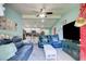 Inviting living room open to kitchen with modern ceiling fan and comfortable seating at 2619 Old Toney Rd, Ellenwood, GA 30294