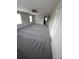 Spacious bedroom with gray carpet, a ceiling fan and two windows providing plenty of light at 2748 Farmstead Ct, Grayson, GA 30017