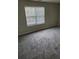 Carpeted bedroom with two bright windows and neutral walls at 2748 Farmstead Ct, Grayson, GA 30017