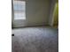 Carpeted bedroom with window and neutral walls at 2748 Farmstead Ct, Grayson, GA 30017
